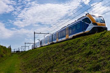 Train on the dyke in Steenwijk. by Brian Morgan