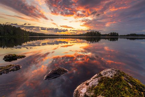 Spectacular red sunset over a lake in Orsa, Sweden