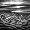 Beach with shapes and patterns at a sunset by eric van der eijk