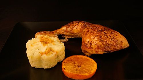 Orange chicken legs with potato-celery puree