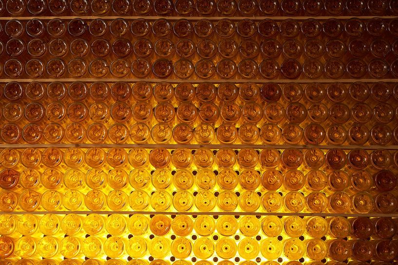 Wine bottles on shelves by Gevk - izuriphoto