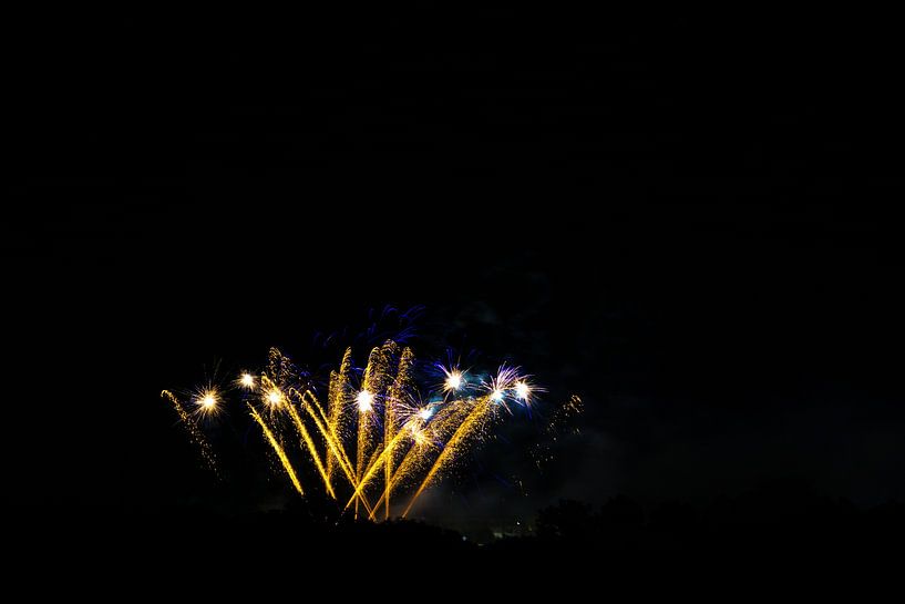 Fantastic fireworks display at huge event with blue and orange colours by adventure-photos