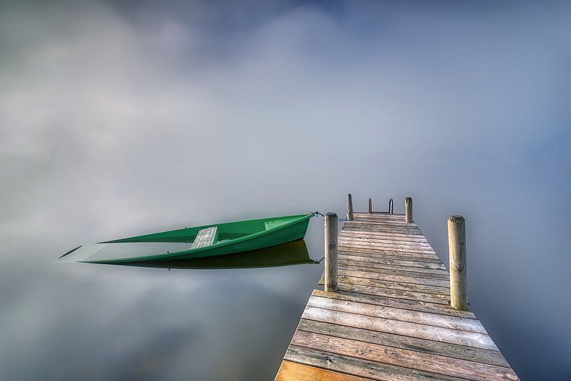 Sinking rowing boat at the jetty in the fog by Judith Kuhn