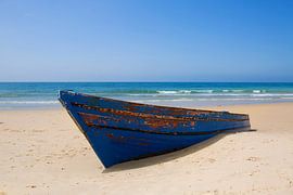 Rowing boat on the beach by Frank Herrmann