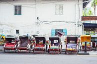 Queue of Rickshaws waiting for customers in Georgetown by Elles Rijsdijk thumbnail