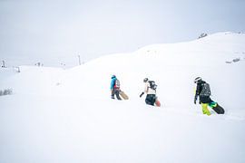 Freeriding powder snow riding in Montafon, Vorarlberg Snowboard group by Leo Schindzielorz