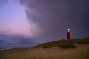 Texel lighthouse in the dunes during a stormy autumn evening