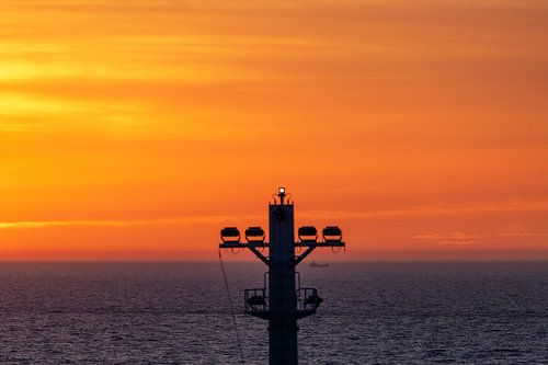 Foremast of tanker against colored background.