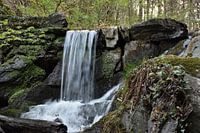 A waterfall between stones