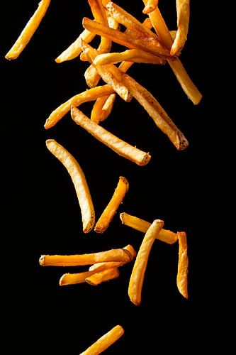 Knapperige frietjes in de lucht - Dynamisch