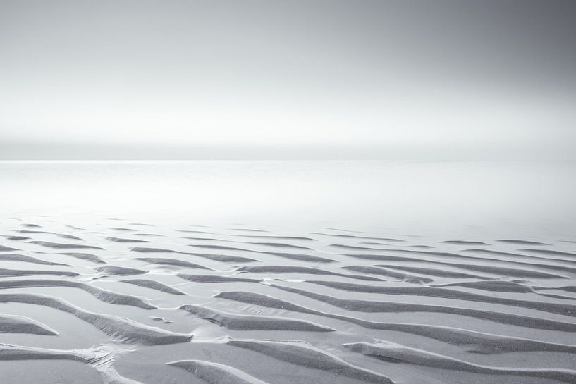 Black and white beach landscape on a quiet evening at sunset by Bas Meelker