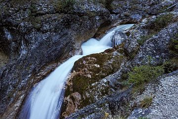 The Gleiersch Gorge in winter with snow, ice, and hanging icicles. by Miriam Schwarzfischer Fotografie