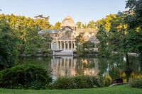 The glass house in the retiro park in Madrid during the first sunlight in summer