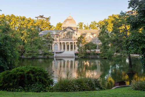 The glass house in the retiro park in Madrid during the first sunlight in summer