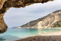 Cave outlook on cove with  sea mountain and gravel beach