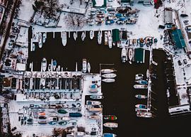 Boats in the harbor of Nieuwedam Amsterdam, Aerial photography above water by Mike Helsloot