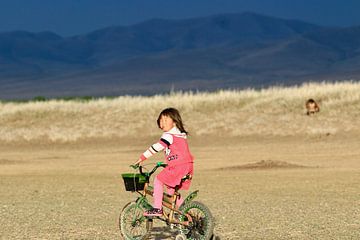 Reluctantly pedaling through the sand by Suitcasefullofsmiles