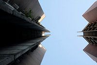 View upwards between two buildings in Skopje, North Macedonia