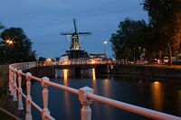 Windmill De Adriaan in Haarlem reflects in the water