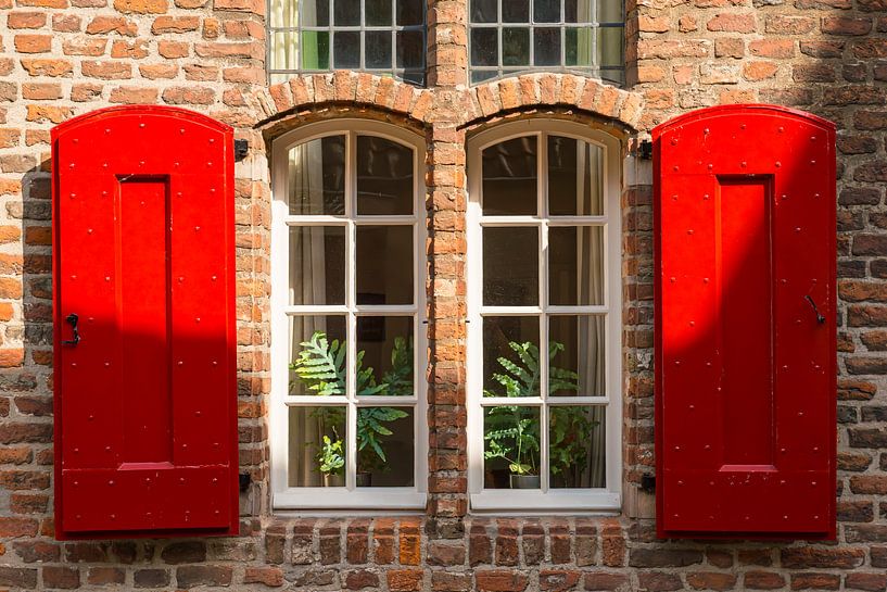 Window with red shutters in Maastricht by Martien Janssen