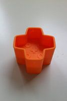 Toy block plus orange