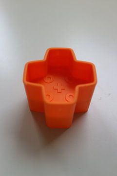 Toy block plus orange