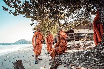 Some Monks looking around on the Beach
