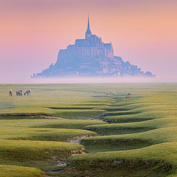 Mont Saint-Michel in the morning mist at sunrise