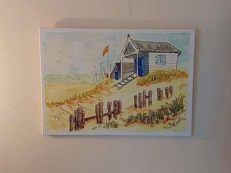 Aquarell eines Strandhauses an einem Sommertag.