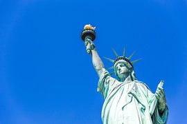 Statue of liberty in New York City, USA with blue sky background by Maria Kray