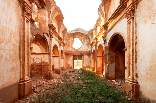 Abandoned church ruins bathed in the light of the sunrise