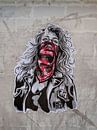 Streetart - vrouw met rode zakdoek van Maarten Leeuwis thumbnail