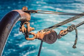 Pulley above water by Maurice Welling