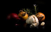 still life of Garlic and onion vegetables with rosemary spice ion black background
