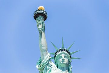 Close view of the Statue of Liberty over blue sky by Maria Kray