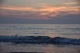 Waves at sunset on a summer night. by Jurjen Jan Snikkenburg
