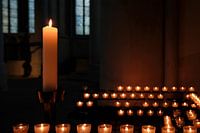 Burning candles in a church