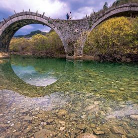 The old stone bridge of Plakida or Kalogeriko of Zagori at the region of Ioannina in Epirus Greece by Konstantinos Lagos
