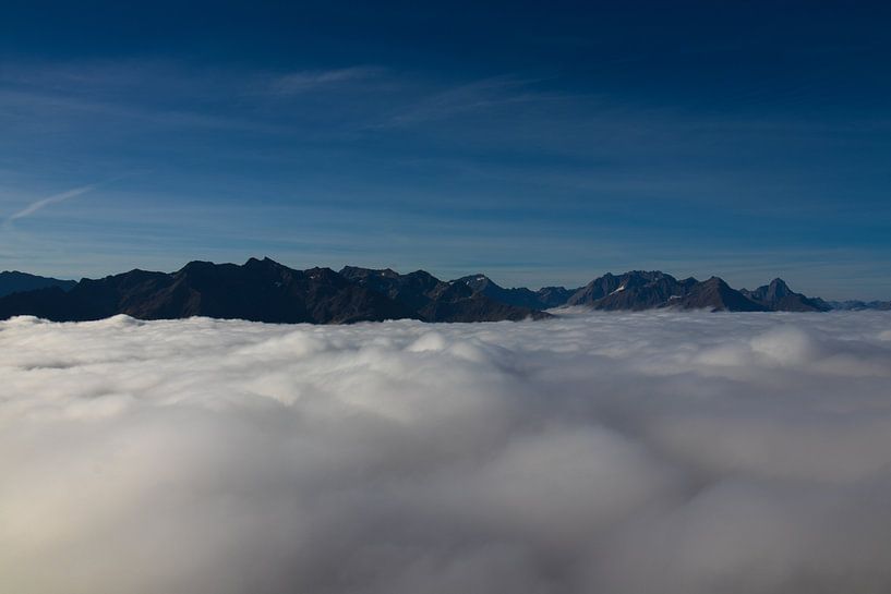 mountains above the clouds by Raf Eussen