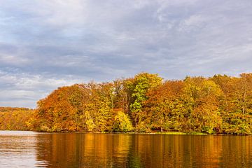 View over the lake Schmaler Luzin to the autumn field mountains