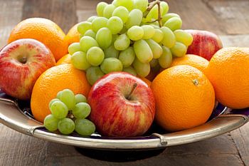 Bowl of colourful fresh fruit on the table