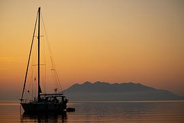 Sailing boat at sunrise