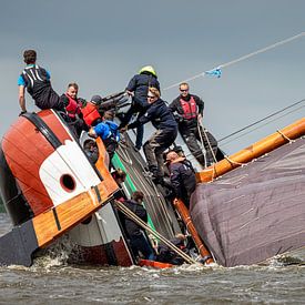 Skûtsje almost capsizes in gust of wind. by ThomasVaer Tom Coehoorn