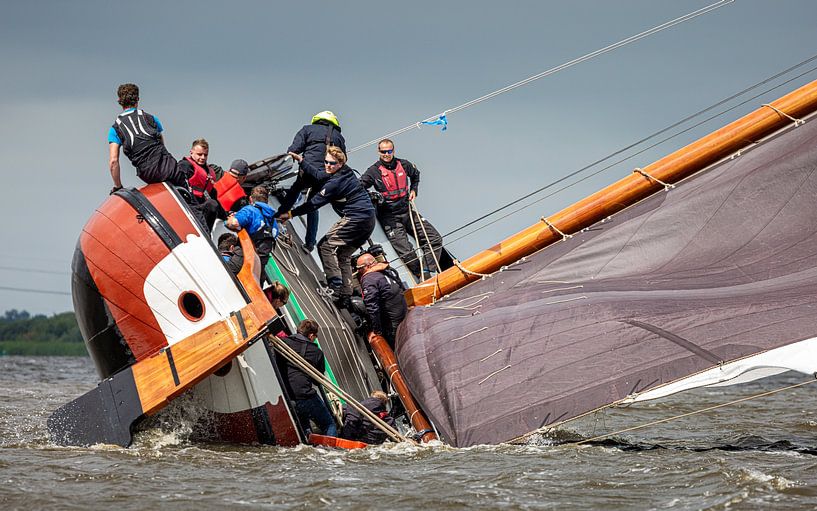Skûtsje almost capsizes in gust of wind. by ThomasVaer Tom Coehoorn