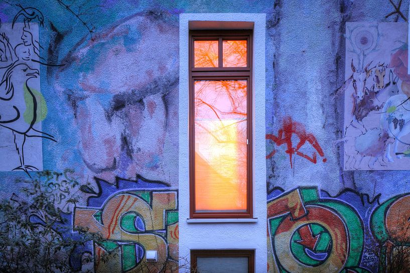Illuminated window, house wall with graffiti by Torsten Krüger