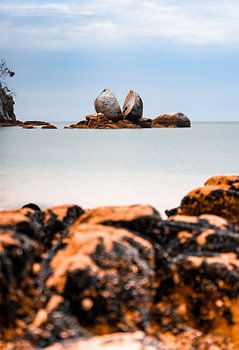 Split Apple Rock in New Zealand in calm landscape