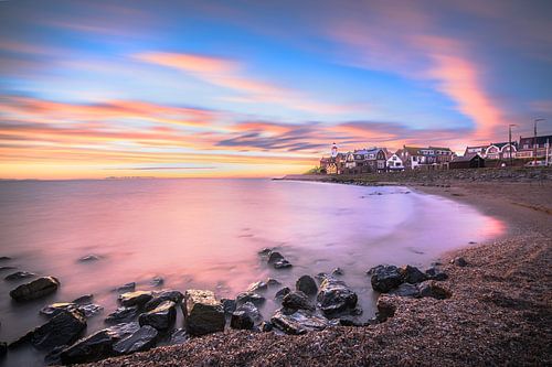 Beach and skyline of Urk at colourful sunset