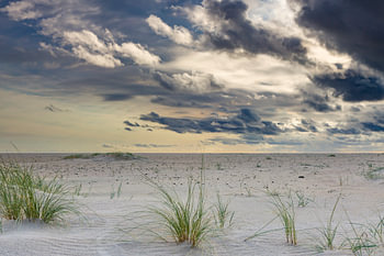 Beach Texel De Hors with imposing clouds.
