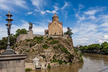 Statue of horseman and Georgian Metekhi Saint Virgin church in the center of Tbilisi, Georgia