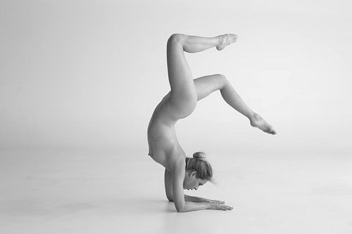 Artistic nude handstand on elbows